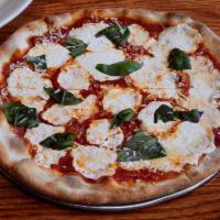 Red Pizza · Fresh mozzarella, red sauce, fresh basil, Parmesan and extra virgin olive oil.