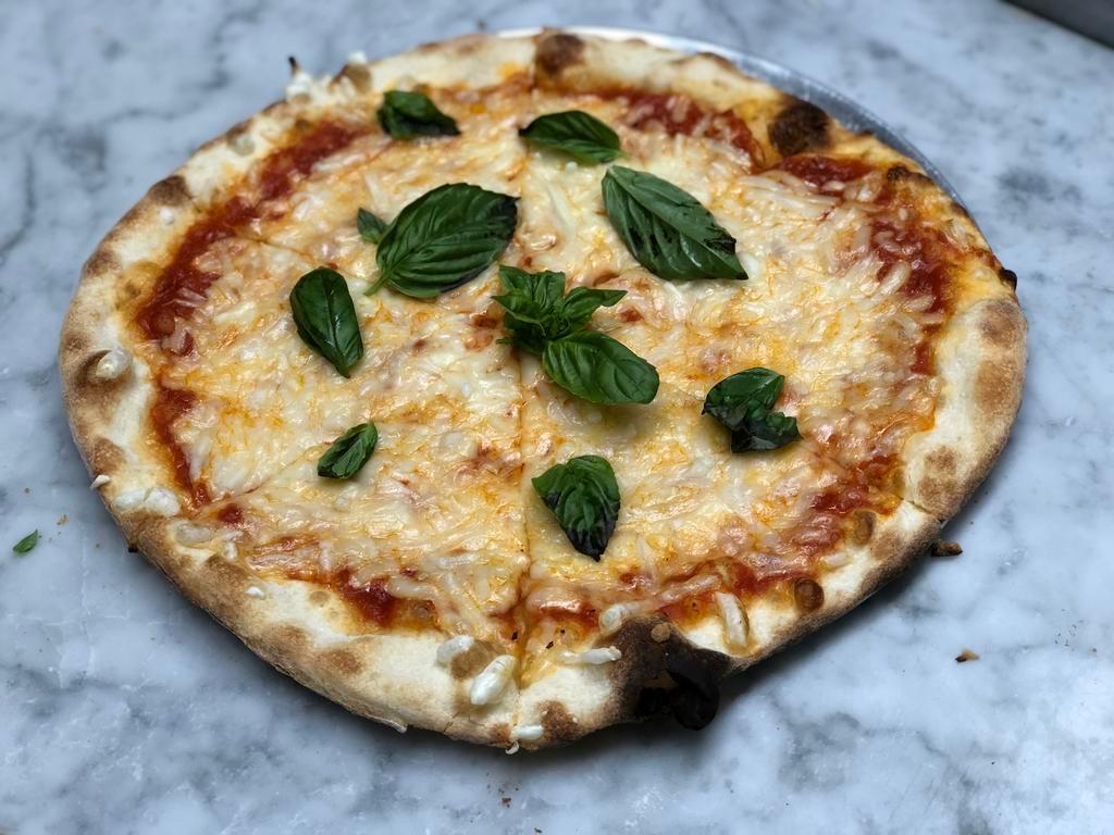 The Vegan Cheese Pizza · Daiya vegan cheese, red sauce and fresh basil.