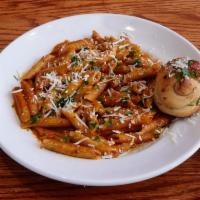 Penne Alla Vodka · Homemade creamy tomato vodka sauce. Served with a garlic knot.