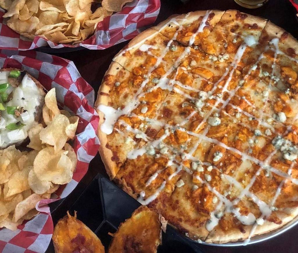 Buffalo Chicken Pizza · White sauce, mozzarella, chicken with choice of either garlic buffalo, mild or hot sauce. Covered with blue cheese crumbles, and drizzled with ranch.