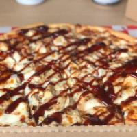 BBQ Chicken Pizza · White sauce, mozzarella, chicken, onions, and drizzled with BBQ sauce.
