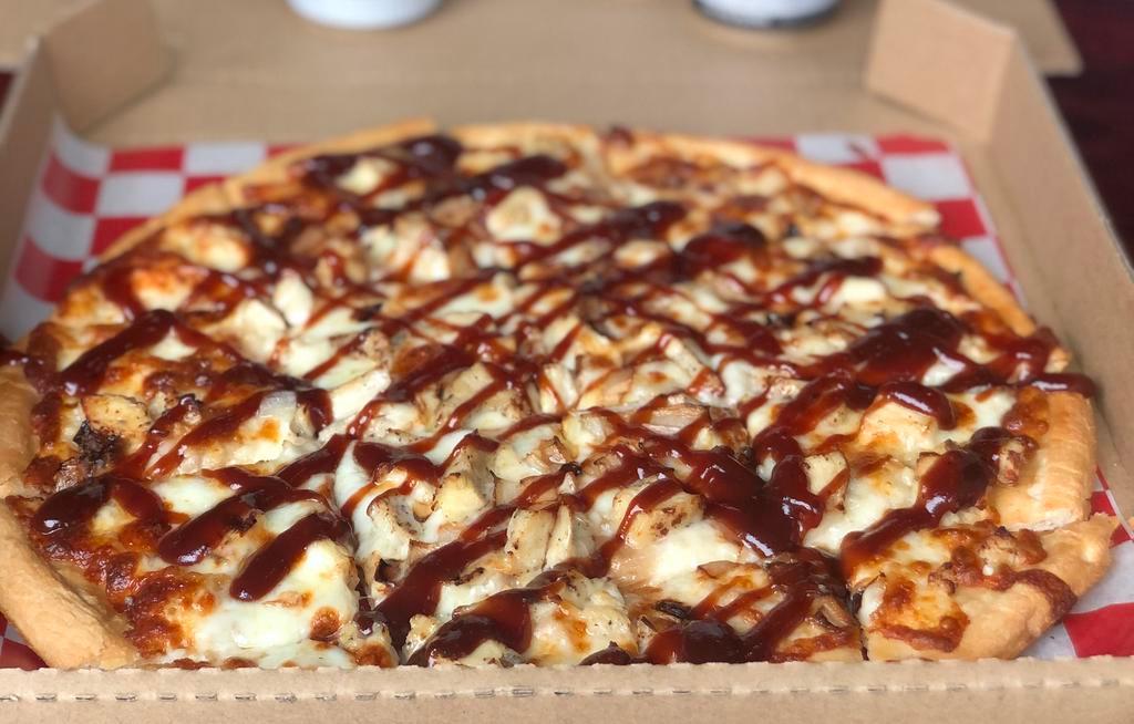 BBQ Chicken Pizza · White sauce, mozzarella, chicken, onions, and drizzled with BBQ sauce.