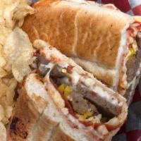 The Gordie Sandwich · Sausage, pepperoni, meatballs, banana peppers, garlic oil, and provolone cheese. Sprinkled w...