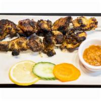 Pork Sekuwa · Marinated and roasted pork in herbs and spices.