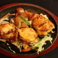 Chicken Breast Tandoori · Chicken breasts marinated in spices, yogurt and mustard oil cooked in a tandoor oven.