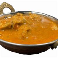 Goat Curry ( choose spicy level ) · Boneless goat chunks cooked in curry sauce.