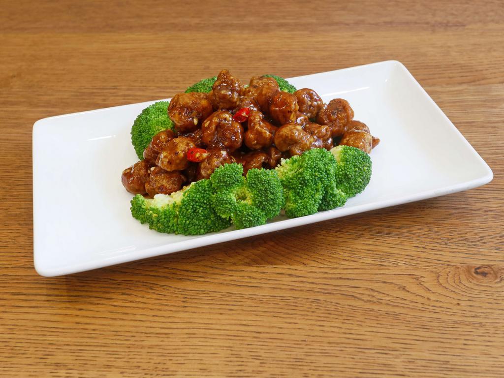 8. General Tso's Chicken · Vegetarian chicken broccoli and topped with cashew nuts. Spicy.