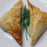 Spanakopita (2 Pcs.) (V) · Spinach and feta cheese, wrapped in phyllo pastry