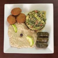 Mediterranean Combo Platter · Quinoa Tabouleh Salad, Grilled Eggplant dip, falafel & grape leaves