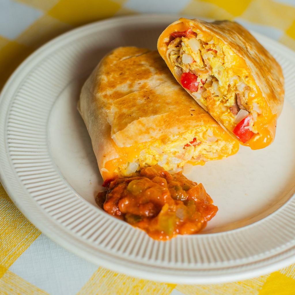 Combo Breakfast Burrito · Scrambled eggs, bacon, sausage, grilled bell peppers, grilled onions, tater tots and cheddar cheese wrapped in a flour tortilla. Served with a side of salsa.
