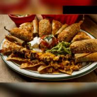 Combination Appetizer · 4 House favorite appetizers: beef or chicken nachos, stuffed jalapenos, beef or chicken ques...