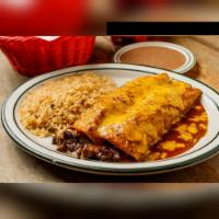 Enchiladas al Carbon · 2 pieces of flour tortillas filled with charbroiled fajita meat and topped with enchilada gr...