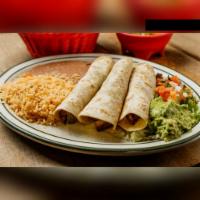 Tacos al Carbon · 3 pieces of beef or chicken fajita tacos. Served with yellow rice, refried beans, guacamole ...