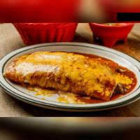 Burrito · 2 pieces of large flour tortillas filled with ground beef or shredded chicken. Topped with g...