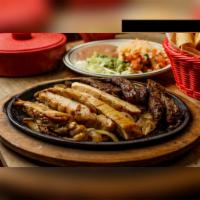 San Lorenzo Fajitas for 2 Special · Serves 2 people. Beef or chicken fajitas with guacamole salad, yellow rice, refried beans, p...