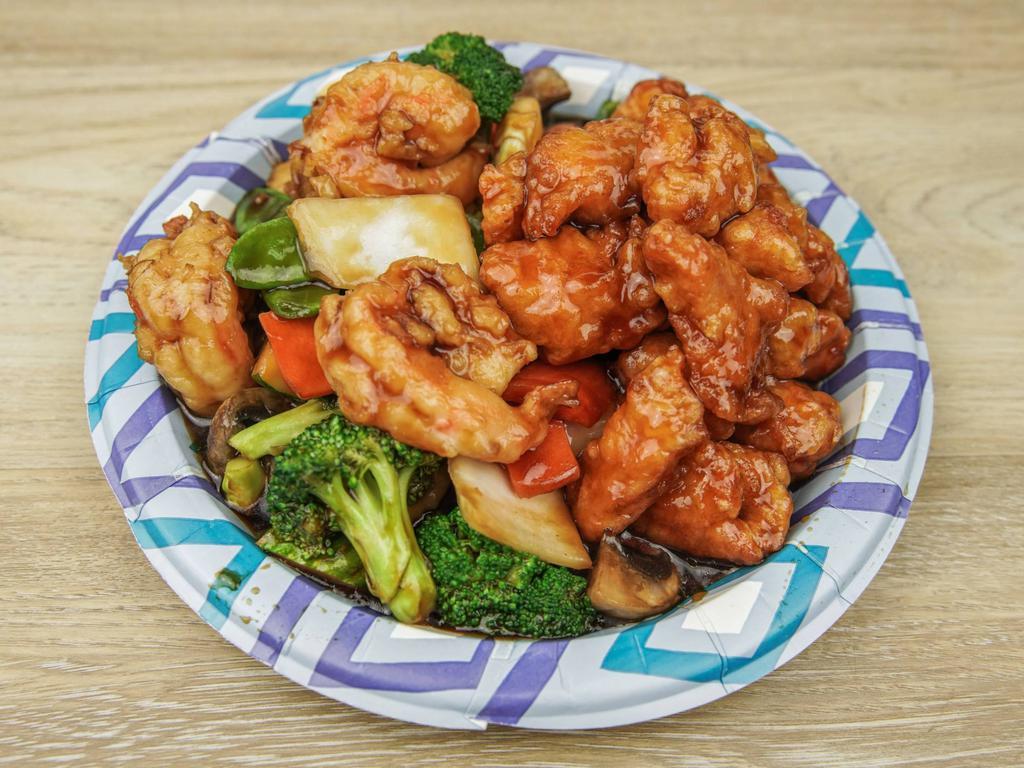 Dragon and Phoenix · Jumbo shrimp sauteed with mixed vegetables and General Tso's chicken on the side.