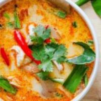 Tom Yum Soup · Hot and sour lemon-grass soup with chicken, mushrooms, onions, kaffir leaves, cilantro, chil...