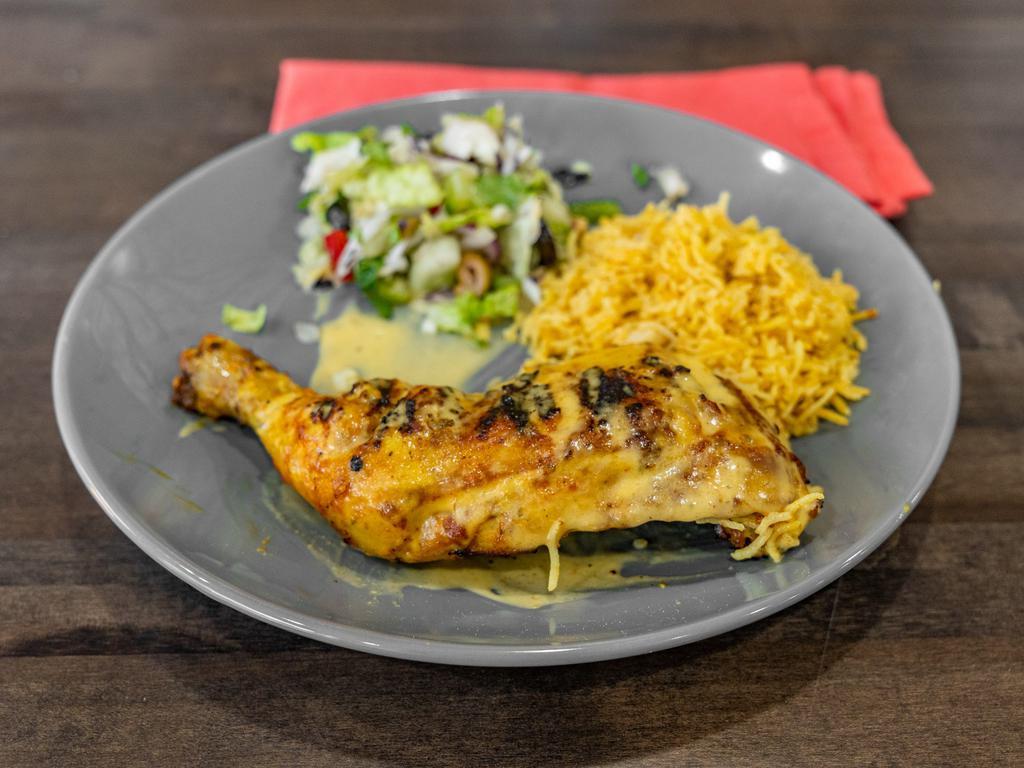 Peri Peri Chicken with Rice · Boneless chicken marinated with peri-peri sauce with rice and salad.