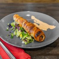 Flames Twistly Kabab Roll · 1 piece. Chicken kebab baked in naan dough with sesame seeds.