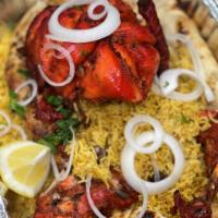 Flames Special Chargha  · Whole chicken seasoned with marinated with tandoori masala. Served with rice, naan, raita (y...