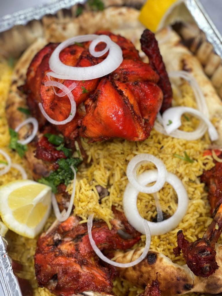 Flames Special Chargha  · Whole chicken seasoned with marinated with tandoori masala. Served with rice, naan, raita (yogurt sauce) and salad.