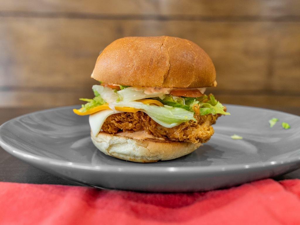 Zinger Burger  · Boneless chicken filet seasoned with Flames spices with lettuce, tomato, onions, and pickle.