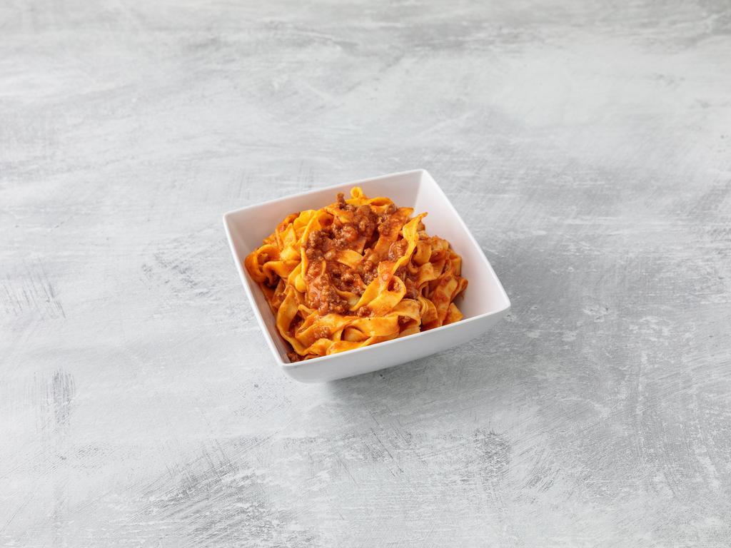 Tagliatelle Bolognese · Meat sauce and Parmesan cheese. Homemade pastas.