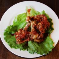 Lollipop Wings (Ga Chien) · Fried chicken wings with a spicy ginger sauce. Gluten free. 4 pieces.