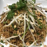 Shallot Noodle · Thin egg noodle in a spicy shallot sauce with fresh bean sprouts garnish crushed peanut.