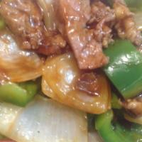 89. Pepper Steak with Onion · Served with white rice.