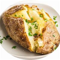Baked potato with butter · Cooked in an oven.