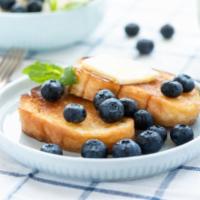 Mixed Berry French Toast · Classic French toast cooked to perfection topped with fresh blueberries, blackberries, and s...