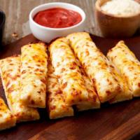 Garlic Breadsticks · A blend of cheeses melted over our delicious dough and brushed with garlic butter sauce.