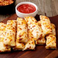 Alpine Breadsticks · A blend of cheeses melted over our delicious dough and brushed with our signature Alpine dre...