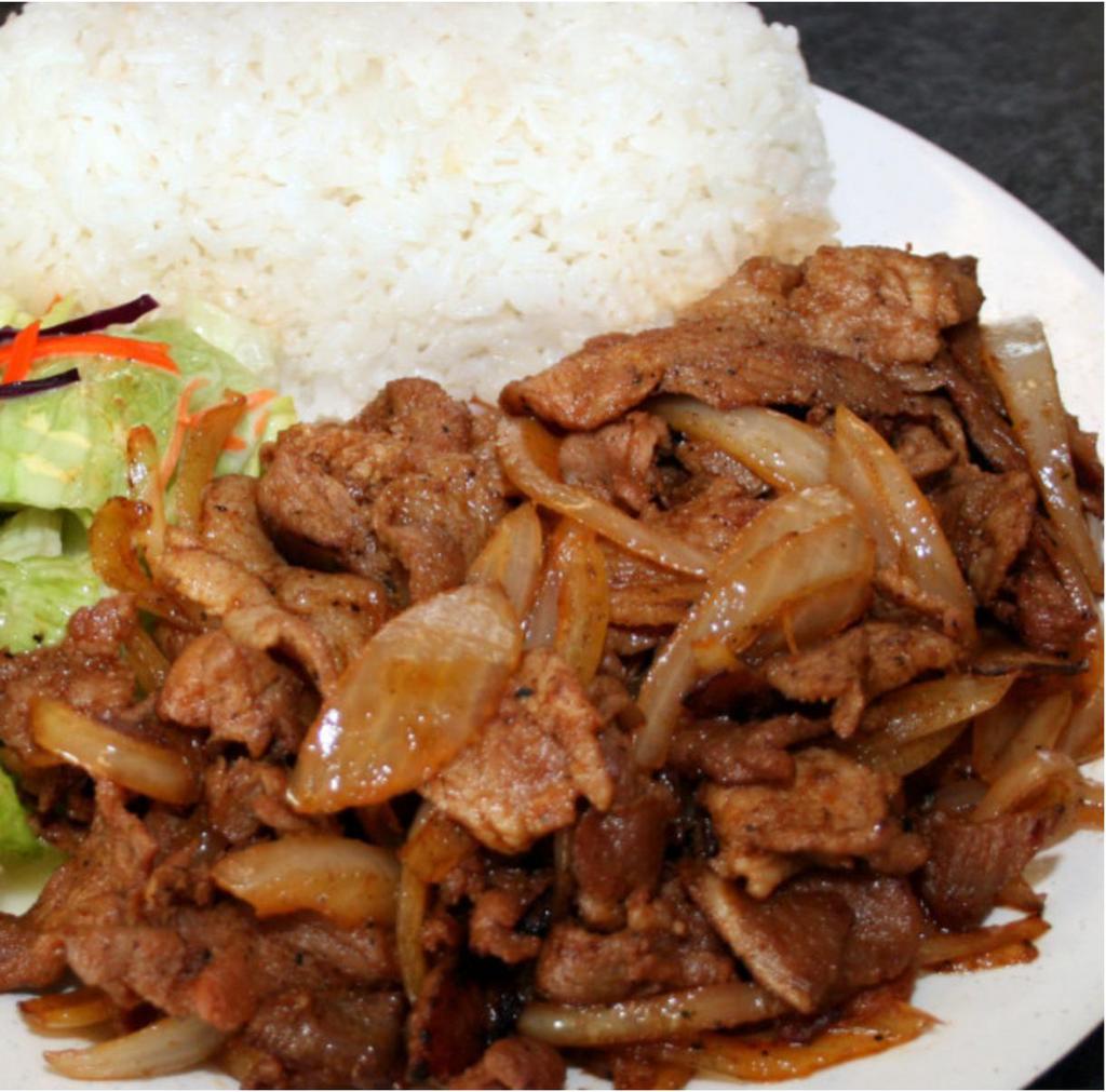 E19. Spicy Pork · Stir-fried pork marinated in our own special sauce. Served with white rice and stir-fried vegetables (cabbage, broccoli, and carrots).