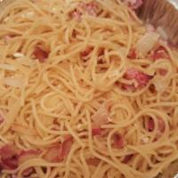 Spaghetti alla Carbonara · Olive oil, onion, ham bacon and egg yolk.