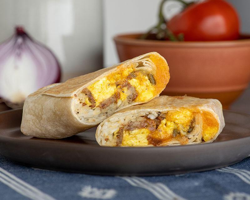 Sausage Breakfast Burrito · Eggs, pork sausage, hash browns, cheddar cheese, jalapeno peppers, flour tortilla.