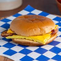 Sunrise Sandwich · Eggs, smoked applewood bacon, melted American cheese, garlic butter, toasted brioche bun.