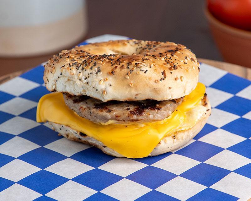 Breakfast Bagel · House egg patty, pork sausage, American cheese, on toasted plain bagel.