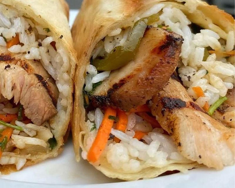 Banh Mì Burrito · Grilled lemongrass chicken, jasmine rice, pickled carrots, daikon, cilantro, jalapeno peppers, toasted flour tortilla.