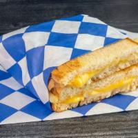 Grilled Cheese Sandwich · Swiss & American cheeses, butter, mayo, sliced sourdough.