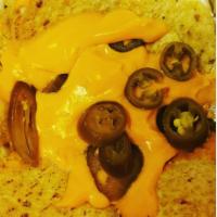 Nachos and Cheese · Tortilla chips and nacho cheese. Add additional toppings to your liking.
