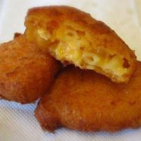 Mac and Cheese Bites · Deep fried triangle shaped batter covered mac and cheese