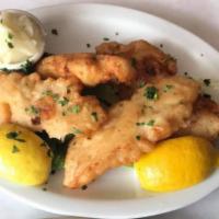 Boukes Bakaliarou · Codfish dipped in batter and panfried to golden brown and served with a touch of garlic dip.
