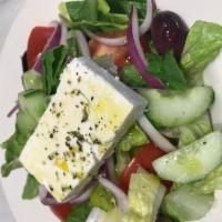 Heleniki Salad · Traditional Greek salad of romaine lettuce, tomatoes, cucumbers, green peppers, feta cheese ...