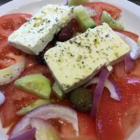 Horiatiki Salad · Tomatoes, onions, cucumbers and feta cheese with house dressing and oregano.