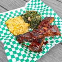 BBQ Favs Plate · Pulled pork or ribs served with mac-n-cheese, greens.
