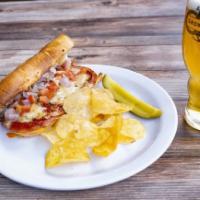 Classic Italia Sub · Sausage, pepperoni, Canadian bacon, tomatoes, onions, mozzarella cheese, and Italian herb dr...