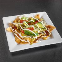 Nachos · Choice of meat. Chips with cheese and a variety of toppings.