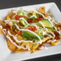 Shrimp Nachos · Chips with cheese and a variety of toppings.